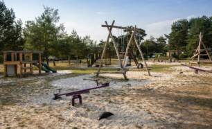 Playground with several climbing frames swing seesaw slide