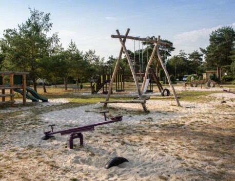 Playground with several climbing frames swing seesaw slide