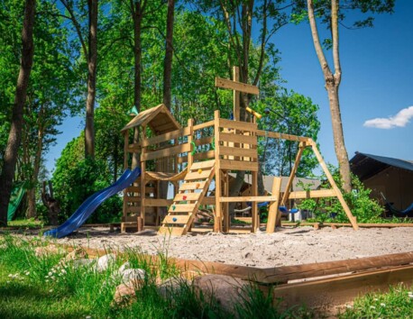 Camping de Tolbrug playground equipment wood slide swing